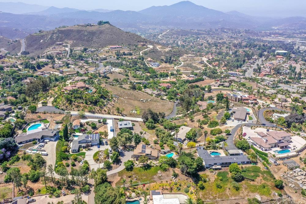 Vista Grande Estates: A 1.1 acre estate with breathtaking panoramic vistas in the prestigious Vista Grande Estates, available for the first time since its creation. This exceptional property offers the perfect multi-generational living experience with unparalleled ocean and sunset views. The estate features a stately main residence with 3+ bedrooms and 2.5 bathrooms, complemented by your private swimming pool & entertaining area, the ideal space for hosting memorable family gatherings. It also hosts a custom Accessory Dwelling Unit, completed in 2024, that adds modern luxury to this already impressive property, featuring an expansive 800 sq ft covered wraparound deck perfect for year-round entertainment. Set on a tranquil acre-plus lot adorned with mature oak trees and productive fruit trees, this residence offers privacy and serenity while maintaining its breathtaking vistas. VRM Seller will entertain offers between tbd. This rare offering represents an unmatched opportunity to embrace luxury living in one of the area's most coveted locations.