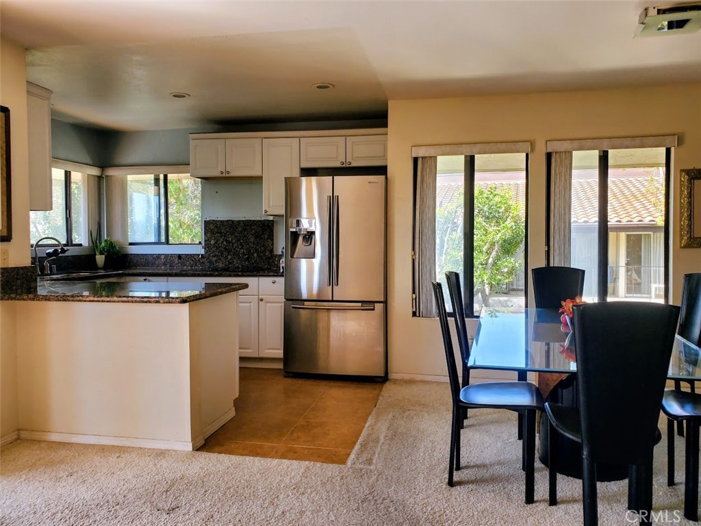 Welcome to 17617 Pomerado Rd Unit 213 — a beautifully remodeled upper-level condo located in the heart of Rancho Bernardo’s highly sought-after 55+ Oaks North community. This 2-bedroom, 2-bathroom home spans 980 square feet and features stunning sunset and city views from its private balcony, offering a tranquil backdrop for daily living.
The interior has been thoughtfully upgraded with a renovated kitchen showcasing new stainless steel appliances, modern cabinetry, granite countertops, and updated lighting. Bathrooms has also been remodeled with quality finishes, providing a clean and refreshed feel throughout. The open-concept layout is light and bright, with large windows, neutral tones, and central air conditioning — a rare and valuable upgrade in this community. The spacious primary suite includes a walk-in closet and an updated ensuite bathroom, while the secondary bedroom offers flexibility for guests or office use.
This well-maintained unit also includes a stacked laundry area and a designated carport for convenience. Residents enjoy access to resort-style amenities through the Oaks North Community Center, which includes a heated pool, spa, sauna, gym, tennis and pickleball courts, lawn bowling, a library, auditorium, billiards, art studio, and organized classes such as pottery, oil painting, yoga, and Tai Chi.
HOA dues include water, trash, cable TV, high-speed Wi-Fi, building insurance, landscaping, secure gated access, and ongoing maintenance of common areas. This community promotes an active and social lifestyle with year-round events and clubs tailored for 55+ living.
Ideally situated just minutes from the Rancho Bernardo Inn and Golf Course, shopping centers, restaurants, medical facilities, and freeway access, this home offers both peace and convenience. Outdoor lovers will also appreciate being within 10 minutes of lakes, nature preserves, and hiking trails.
This is a rare opportunity to own an upgraded unit with premium views in one of North County San Diego’s most vibrant active adult communities. Schedule your private showing today and discover the Oaks North lifestyle for yourself.