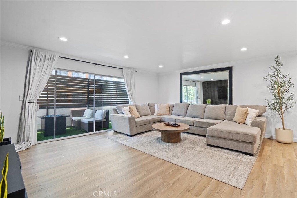 LOCATION, LOCATION, LOCATION!! Stylish Renovated Condo in the Heart of Sherman Oaks. Welcome to this beautifully updated condo, offering modern living in one of Sherman Oaks’ most desirable locations. This tastefully renovated 2-bedroom, 2-bathroom home features an open floor plan with contemporary finishes and thoughtful upgrades throughout. Step into the inviting living room highlighted by a custom accent wall that adds a touch of elegance and warmth. The open-concept kitchen is a chef’s dream, complete with quartz countertops, a large farmhouse sink, newer stainless-steel appliances, and soft-close cabinetry with convenient pull-out drawers. The spacious primary suite includes his-and-her closet space and a stunning ensuite bathroom with a sleek stand-alone shower, floating vanity, and built-in shelving. The second bedroom offers versatility—perfect as a guest room, home office, or both—complete with a custom built-in desk and shelving. Additional features include an updated hallway bathroom with shower/tub combo and modern vanity, recessed lighting throughout, updated flooring, In-unit washer and dryer, Alexa smart home system and a private balcony overlooking the heated pool. The secure building offers 24-hour surveillance, intercom entry, underground parking, and elevator access. Located just moments from popular shops, restaurants, parks, and top-rated schools, this condo is the perfect blend of style, comfort, and convenience. Don’t miss this opportunity to own a turnkey home in the heart of Sherman Oaks!