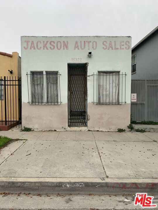 Great opportunity In business area! Structure in front needs extensive work. Ally access to the rear of the property which has a metal roof that covers most of the lot. Property profile shows use as a Single Family but it is more suitable for a business. It's also zoned for a business.