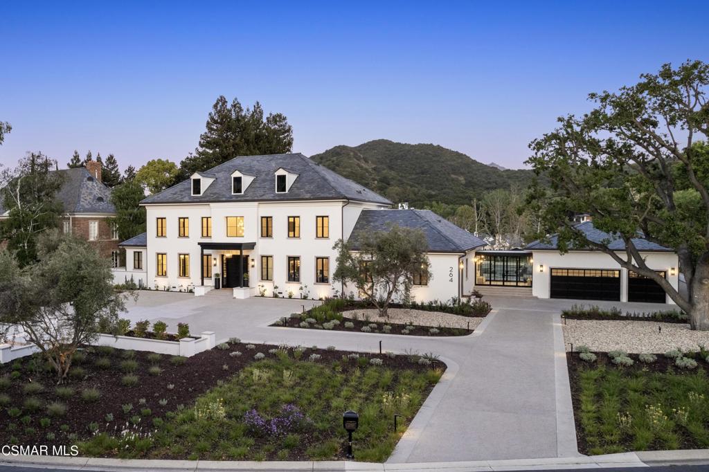 Step into modern elegance with this stunning contemporary estate, completely reimagined and rebuilt on a coveted 1.2-acre lot, offering breathtaking views of the 11th, 13th, and 14th fairways of the prestigious Sherwood Country Club golf course. Designed with a neutral palette and refined finishes that enhance its modern yet timeless style, this home embodies the ultimate California dream lifestyle.Featuring 6 bedrooms and 7 bathrooms, the expansive layout includes a luxurious first-floor primary suite, while the upper level offers 4 ensuite bedrooms, each a stylish and comfortable retreat. Floor-to-ceiling windows flood the home with natural light, showcasing the epic yard, golf course, and surrounding mountains. An upstairs media room provides the perfect space for relaxation. The open floor plan flows seamlessly from the gourmet kitchen to a sleek pub/bar, ideal for hosting, complemented by a catering kitchen designed to meet all culinary needs. Additionally, a charming 1-bedroom guest house offers a private haven for visitors.Outdoors, a private paradise awaits. Enjoy a hotel-sized pool and spa, outdoor kitchen, fire pit, and bocce ball court, all set amidst fire-lit seating areas and a picturesque vineyard--perfect for unforgettable gatherings.Situated within the exclusive, guard-gated community of Sherwood Country Club Estates, this home offers more than luxury living--it's an unmatched lifestyle. Membership options include access to two Jack Nicklaus-designed golf courses, tennis, pickleball, swimming, and more. Nearby Lake Sherwood is ideal for boating, kayaking, paddleboarding, and fishing.This is more than a home--it's a dream realized, where every detail invites you to experience a life of beauty, comfort, and inspiration.