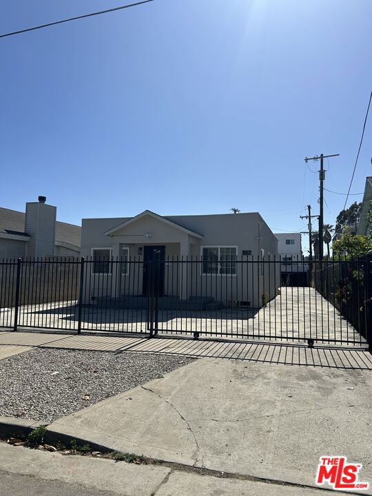 This newly remodeled charming property features three units in total, consisting of three bedroom plus three-bathroom unit. Three bedrooms with each of their own bathrooms, and separate entrances, making it an ideal living space with privacy and possible extra income. Three parking spaces in front of the unit. Security screen door and gated driveway. The property's prime location is a standout feature, providing easy access to popular attractions such as the renowned Hollywood Bowl, prestigious universities, vibrant shopping centers, the bustling downtown Los Angeles area, and a variety of museums. Close to fwys and public transportation. Move in ready.