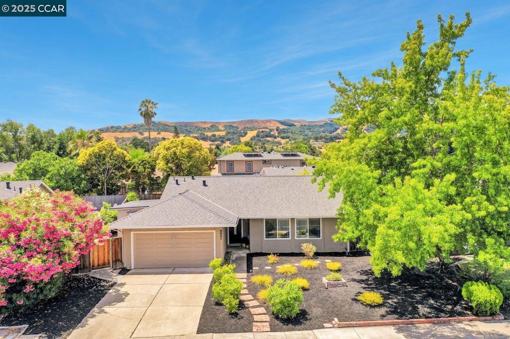 This thoughtfully updated NE FACING, move-in-ready home offers the perfect blend of modern comfort and everyday convenience in a highly sought-after San Ramon neighborhood. The inviting single-story floor plan features luxury plank flooring, recessed lighting, and fresh interior paint throughout. Enjoy peace of mind with a new roof and newer dual-pane windows. The updated kitchen boasts stainless steel appliances, ample cabinet storage, and a charming breakfast nook ideal for casual meals. A cozy fireplace anchors the living room, creating a warm space to unwind. The spacious primary suite includes direct access to the backyard and a remodeled en-suite bath. Two additional bedrooms share a beautifully updated hall bathroom. Step outside to your private backyard oasis, featuring three separate patios—perfect for entertaining, gardening, or relaxing in the sun. Don’t miss the fruit-bearing lemon tree for your fresh citrus fix! Ideally located within walking distance to top-rated San Ramon schools, scenic parks, trails, and the community pool, plus easy access to shopping, dining, and major commuter routes including BART, I-580, and I-680.