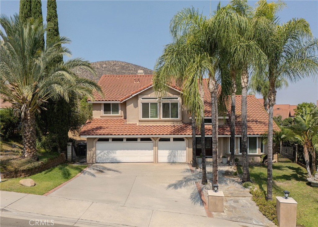 Welcome to this beautiful two-story home located in the highly sought-after " LAKE HILLS " community of Riverside. As you enter through the elegant double doors , you're greeted by a spacious formal living and dining area with high vaulted ceilings. The open concept flows into a warm and inviting family room featuring a fireplace, crown molding, recessed lighting and laminate wood flooring thoughout. The updated kitchen features premium granite countertops, a full backsplash, stainless steel appliances and elegant cabinetry. A bright breakfast nook just off the kitchen provides the perfect spot to enjoy morning coffee. This well-designed home offers 5 bedrooms and 3 full bathrooms including a convenient downstairs bedroom and full bathroom ideal for guest.. Upstairs the expansive primary suite boasts hign ceilings and a luxurious ensuite with a walk-in closet, a soaking tub, separate walk-in shower and dual vanities. A fifth bedroom can easily function as a bonus room, home office or gym. All bathrooms have been renovated, the home includes dual-pane windows for energy efficiency, ceiling fans throughout andf a 3 car garage with direct house access. Step outside to your private backyard beautifully landscaped with a large patio, custom built-in BBQ island and patio cover with recessed lighting perfect for outdoor entertaining year round. Close to parks, schools, Kaiser Hospital, shopping, dining and easy access to the 91 Freeway and Metrolink.