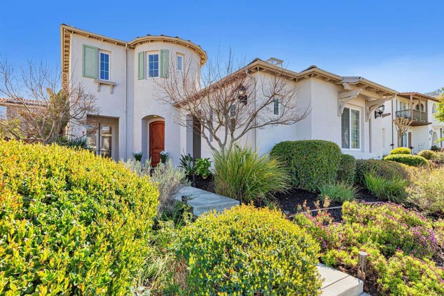 Welcome to this stunning home in the prestigious, gated golf course community of Eagle Ridge. With serene views of the surrounding mountains and 3,688 sq.ft. of elegant living space on a generously sized lot, this luxurious 5 bedroom, 4 ½ bathroom home offers a perfect blend of comfort & style. Beyond the impressive turret entry, you'll notice a beautiful formal dining room & rich hardwood floors that flow throughout the home. The family & living rooms, each with its own fireplace, open to a private courtyard oasis with bistro lighting, creating a welcoming atmosphere ideal for relaxation & entertaining. The spacious kitchen features gorgeous granite countertops, double ovens, and center island w/ sink. The home's thoughtful design includes TWO ground floor bedrooms, each with its own full bathroom. One bedroom has an outside private entrance, perfect for an office, college student, or extended family. Upstairs there are 3 more bedrooms including the primary suite which is a true retreat, complete with a jetted tub, stall shower, balcony, and plenty of space to unwind. Step outside to the exquisite flagstone backyard, which offers two levels perfect for outdoor entertaining. Enjoy Eagle Ridge amenities including swimming pool, pickleball courts, playgrounds, and so much more!