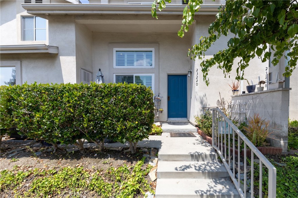 This beautifully maintained 3-bed, 2.5-bath corner-unit townhome is nestled in Carson’s gated Colony Park community. The open-concept layout boasts soaring cathedral ceilings and abundant natural light flowing through the spacious living and dining areas. The kitchen features refinished cabinetry, granite counters, stainless steel appliances, and a charming breakfast nook. Upstairs, the primary suite offers a private bath with granite counters and ample closet space, while one bedroom has its own full hall bath. One bedroom downstairs is perfect for office space or in-laws suite. Additional highlights include upstairs laundry, laminate flooring, custom paint, and a direct-access two-car garage with extra storage. The oversized patio is perfect for entertaining and just steps from the pool and spa. Enjoy resort-style amenities and walkable access to schools, shops, dining, and freeways.
