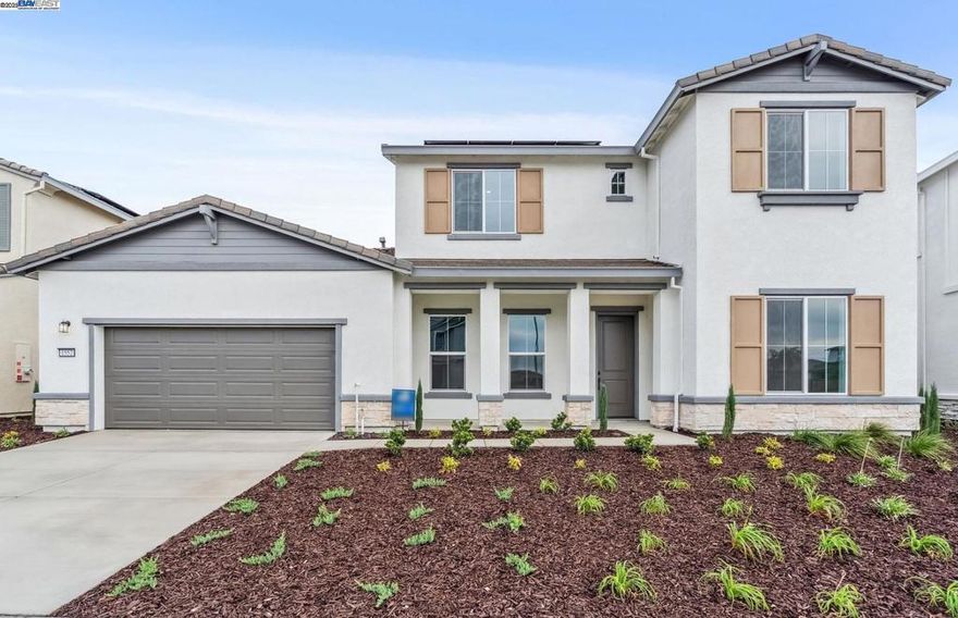This two-story Oxford home features an open floor plan with a loft and is available now. This home includes quartz kitchen countertops with a full backsplash, grey cabinets, Whirlpool stainless steel appliances and upgraded flooring.
