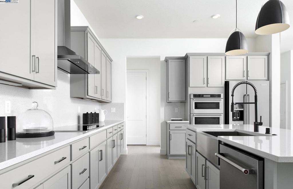 This two-story Oxford home features an open floor plan with a loft and is available now. This home includes quartz kitchen countertops with a full backsplash, grey cabinets, Whirlpool stainless steel appliances and upgraded flooring.