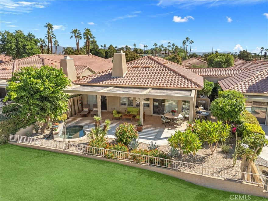 Experience the best of desert resort living at this private and peaceful retreat, perfectly positioned on the fairway with breathtaking, head-on mountain views. Located within the highly desirable and guard-gated Rancho Mirage Country Club, this elegant single-level residence features three bedrooms and three bathrooms, including an oversized primary suite with a spa-like ensuite and direct access to the patio overlooking the fairway.



A double-door entry opens to tall ceilings and a spacious, open-concept layout that flows effortlessly from the living and dining areas to the outdoors. The expansive great room showcases a gas fireplace and walls of glass framing stunning views, while the bright kitchen faces east, welcoming soft morning light filtered through citrus trees. The third bedroom doubles as an office or den with a full ensuite bath, and the large laundry room and two-car garage (plus golf cart space) provide everyday convenience.



The standout feature of this home is the large, walled and private patio—professionally landscaped and designed for both entertaining and relaxation. Its centerpiece is a custom, heated “spool” (spa-pool combination) that was recently replastered and upgraded with PebbleTec for long-term durability and an elevated finish. Surrounded by citrus trees and multiple seating areas, the patio offers the perfect blend of privacy and connection to the fairway.



Just a few homes down from one of the community pools, this property offers both tranquility and easy access to resort-style amenities including a private 9-hole golf course, tennis courts, multiple pools and spas, and lush greenbelts throughout. Ideally situated minutes from Eisenhower Medical Center, The River, and El Paseo’s dining and shopping, this home offers a rare blend of comfort, convenience, and value.



This home won’t last long—its exceptional value and serene fairway setting make it one of the most compelling offerings in Rancho Mirage.