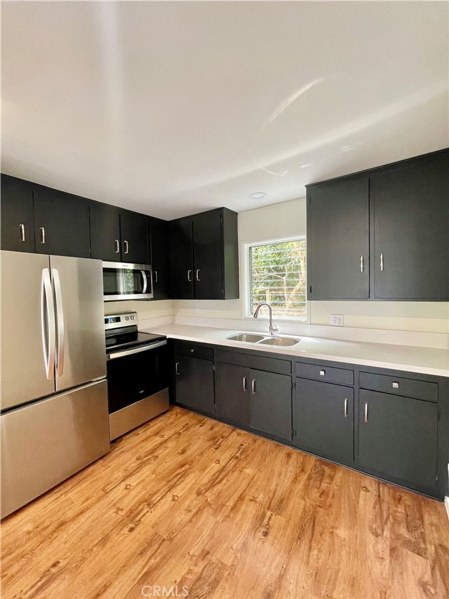 Great light and bright remodeled central village lower apartment located within walking distance to beach and town. Lower unit of back building, this unit offers new wood floors and fresh paint. Full remodeled kitchen including refrigerator and gas stove, fireplace, dining area, free shared laundry.  Street parking. Walk everywhere