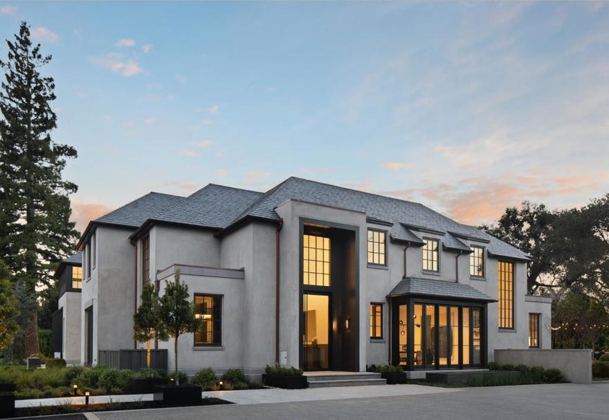 Conceived and constructed with the highest level of architectural innovation and the finest materials, this estate presents a rare blend of authentic timelessness coupled with modern aesthetic. The home was completed in 2019 and offers over 14,000 total square feet on an extremely private acre of land. The immaculate gourmet kitchen will please the most discerning chef, while the adjacent great room offers a compelling venue for relaxed gatherings.  Accessible by an elevator and dual staircases, the upper level of the residence features a luxurious master retreat and three additional bedroom suites, while the lower level is poised for recreation with a home theater, exercise studio, entertaining bar and wine room. Interior comfort fluidly transitions to outdoor amenities including a full guest house, fire pit, entertaining pavilion, sport court, pool, spa and elegant dining terrace with overhead market lights. This exceptional residence is just moments from top private schools.