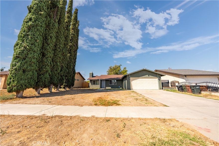 This inviting single-story house features 3 bedrooms and 2 bathrooms, offering 1,137 square feet of comfortable living space. Built in 1978, the home includes an attached two-car garage for convenient parking and storage. The house boasts a charming front yard and a spacious backyard, perfect for outdoor activities, gardening, or relaxing. Situated in a nice neighborhood, it provides a peaceful and friendly community setting. With a practical layout and ample outdoor space, this home is ideal for easy living and enjoying quality time both indoors and out.