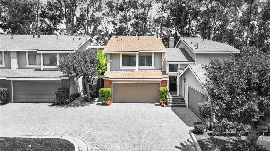Indulge in breathtaking views of the prestigious Anaheim Hills Golf Course from this elegantly appointed townhome, nestled in the exclusive Parkview community, an enclave renowned for its tranquil setting, rolling greenbelts, and upscale ambiance, where higher-end homes set the stage for this beautifully updated residence. Step inside and be captivated by soaring 20-foot vaulted ceilings, an abundance of natural light pouring through expansive windows, adorned with exquisite tile flooring that flows seamlessly throughout creating an ambiance of timeless sophistication and open-air grandeur. An open concept living space invites you anchored by a dramatic floor-to-ceiling custom fireplace that serves as a striking focal point and flows effortlessly into the expansive dining area. Enjoy an upgraded kitchen equipped with quartz countertops, soft closing drawers, stainless steel appliances, mosaic tile backsplash, and recessed lighting that highlights the peninsula breakfast bar. An eye-catching custom barn door leads you to the outdoor patio with scenic views of mature eucalyptus trees, lush greenery, and golf course views that create the perfect backdrop for alfresco living. A thoughtfully designed powder room offers a sophisticated touch perfect for guests and everyday convenience featuring a modern vanity with rich cabinetry, a smooth solid-surface countertop, and brushed nickel fixtures. Upstairs awaits a spacious primary bedroom with a walk-in closet and a spa-inspired ensuite, beautifully updated with dual vanities in rich espresso cabinetry, quartz countertops, framed mirrors, and a walk-in glass-enclosed shower featuring contemporary tilework and a sleek rain-style showerhead. Wood-look flooring adds warmth and texture, enhancing the space with thoughtful design and upscale finishes. In addition to the luxurious primary suite, the home offers two generously sized bedrooms and another full bathroom that mirrors the spa-inspired elegance of the primary ensuite. Perfectly positioned near the prestigious Anaheim Hills Golf Course and the serene Oak Canyon Nature Center, this residence enjoys a coveted backdrop along the Oak Canyon Trail, offering instant access to nature’s beauty and miles of scenic walking paths. Residents relish the convenience of a community pool and BBQ area, all while being mere minutes from Anaheim Hills Plaza, El Rancho Plaza, the 91-freeway, and top-rated schools striking the perfect balance of elegance, comfort, and location.