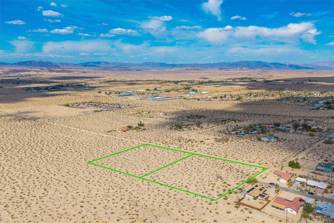 Here’s a rare opportunity to own two side-by-side 2.23-acre parcels in the heart of 29 Palms. Originally part of the planned but never completed *Tortoise Rock Phase 2* project, these properties are now available for visionary investors or builders ready to create something special.
Each parcel offers legal access through the city and is zoned RS-4, allowing for flexible development options: build a single-family home with both an ADU and a Junior ADU, or subdivide down to four lots per acre (Buyer to verify all details with the City of 29 Palms).
These parcels are in the water district (no meter yet) and have power nearby, making development even more accessible. Located near downtown 29 Palms, just moments from The Historic Plaza and a short drive to the Joshua Tree National Park entrance, the location is unbeatable.
And the best part? The views are absolutely epic — a wide-open desert canvas framed by majestic mountains and painted skies.