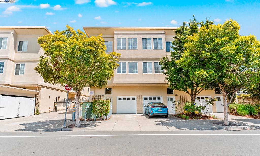 This modern, sunlit 3BD/3.5BA end-unit townhouse in Albany spans 1,454 sq ft over three levels, just steps from vibrant Solano Ave—a highly walkable street brimming with diverse restaurants, unique shops, and local charm. Freshly painted with natural lighting and luxury flooring, it boasts a ground-floor bedroom with en-suite bath, perfect for guests or an office. The open second floor, great for entertaining, includes a bright living/dining area, new stainless steel appliances, wood cabinetry, a breakfast bar, a half bath with in-unit laundry, and a cozy patio for coffee or gardening. Upstairs, find a bedroom with a private balcony, a hallway full bath with vanity, and a spacious primary suite with dual vanity, Jacuzzi Jetted tub, and distant San Francisco skyline views. The attached garage features a unique car stacker for two vehicles. In Albany (Walk Score: 97), top-rated schools— Cornell elementary, middle, and the famous Albany High school —are within walking distance and rank among the East Coast’s best. Close to popular Solano ave with unique shops and restaurants, BART, AC Transit, 580 Freeways, Trader Joe’s, Lucky, Whole Foods, Sprouts, CVS, Costco, Sutter Health Albany Care Center, and urgent care clinics, this home perfectly blends urban convenience with comfort.