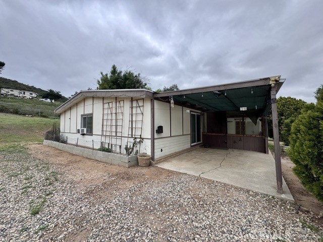 Attention Horse Lovers! Welcome to this charming 2 bedroom, 2 bathroom ranch style home, located on a spacious lot in the heart of Menifee. Perfect for equestrian enthusiasts, this property offers a unique lifestyle opportunity with horse stables on-site and room to roam. This listing is for the rear home on the property, which features provacy. (Please refer to the map in the photos for exact location.) Inside, you’ll find a comfortable layout that includes a living room, formal dining area, and a well equipped kitchen. The primary bedroom is generously sized and features an ensuite bathroom with dual sinks, a soaking tub, and a separate shower. There's also a convenient laundry room and a fenced backyard, perfect relaxing outdoors. What makes this home truly special is the private horse stall located directly behind the house, allowing you to board your horse just steps from your door. With peaceful surroundings and open skies, it’s an ideal setting for those who love country living with the added comfort and convenience. Enjoy the serenity of ranch-style life, whether it’s with your horses, or just soaking in the natural beauty around you. Schedule your private showing today and experience the lifestyle you’ve been dreaming of!
