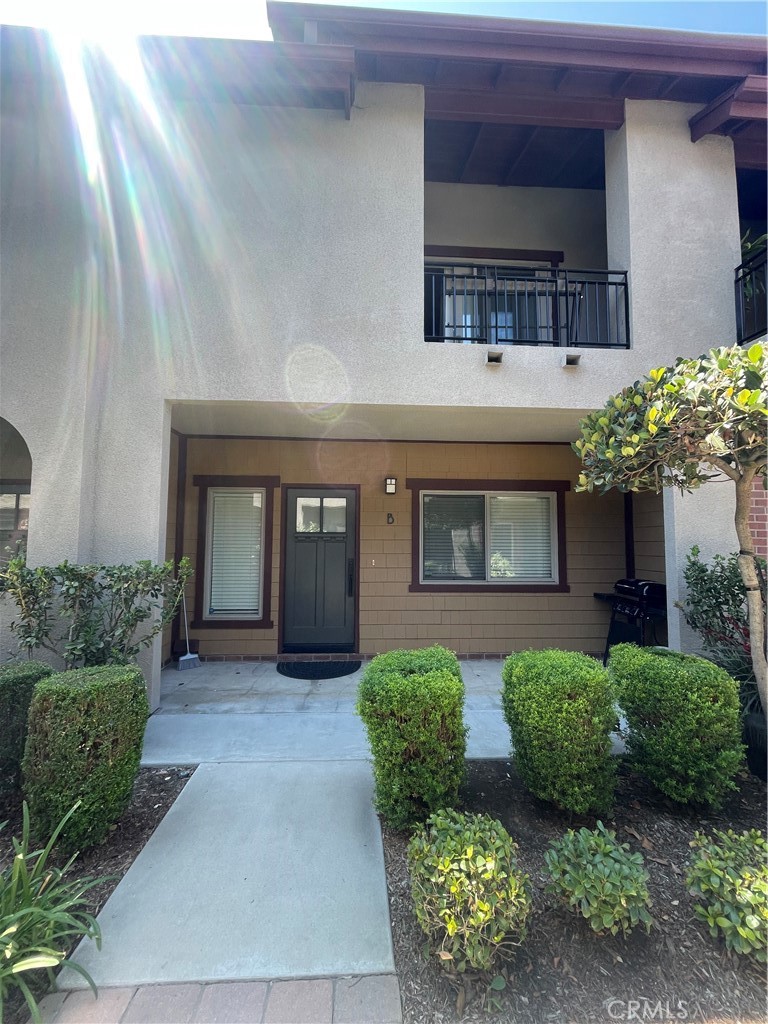 Welcome to The Colony!!!! This is a move-in ready condominium located in an exclusive gated community in the heart of the beautiful city of Azusa. This home features 2 large bedrooms and 2.5 bathrooms. The primary bedroom boasts a private balcony, walk-in closet and full bathroom, the second bedroom features 3/4 bathroom with a walk-in shower. The spacious living area has beautiful, laminated flooring, high ceiling with recessed lighting, 1/2 bathroom, and a cozy fireplace. The upgraded kitchen features granite countertops and direct access to a private balcony. The 2-car garage provides direct access to the home, offering a laundry area with plenty of storage. The community features a well-maintained pool and jacuzzi. The HOA includes trash, water, security gates, pool, and jacuzzi maintenance.