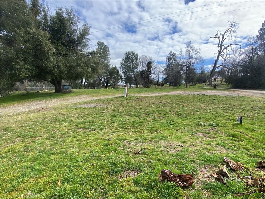 Flat, useable half acre parcel located in beautiful North Fork! There was once a mobile home on this property with septic, power and access to water at the neighboring well. No well agreement exists here, however current owner would be open to establishing a shared well agreement. Here you will find a basketball hoop, fenced garden area and a cement walkway that was placed for the previous mobile home. There are some gorgeous peek-a-boo views of Peckinpah Ridge at the back of the property as well. Build a home, place a manufactured home or let your imagination do the building.