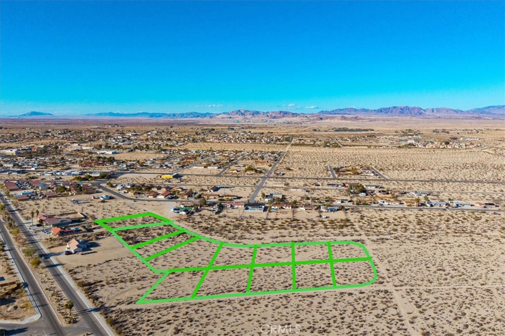 Prime 5.51-Acre Residential Development Opportunity in 29 Palms!
Discover an exceptional opportunity with this expansive 5.51-acre parcel located in the growing community of Twentynine Palms. Situated in a peaceful residential area, this property offers a rare combination of size, flexibility, and development potential.
Zoned for residential use, the land presents numerous possibilities for builders, investors, or those looking to create a thoughtfully planned housing project. Notably, based on recent discussions with the City of Twentynine Palms, this parcel was originally subdivided into 13 individual lots. There may be potential to reestablish this original 13-lot configuration—offering a valuable head start for future development. Buyers are strongly encouraged to verify all subdivision and zoning options directly with the city.
With ample space, scenic desert views, and close proximity to local amenities, schools, and Joshua Tree National Park, this property is ideally positioned for a residential community or custom home development. Utilities appear to be nearby (buyer to verify), further supporting the feasibility of future projects.
Whether you're looking to build a multi-lot subdivision or invest in land with long-term upside, this parcel offers incredible potential in one of Southern California’s most dynamic desert markets.