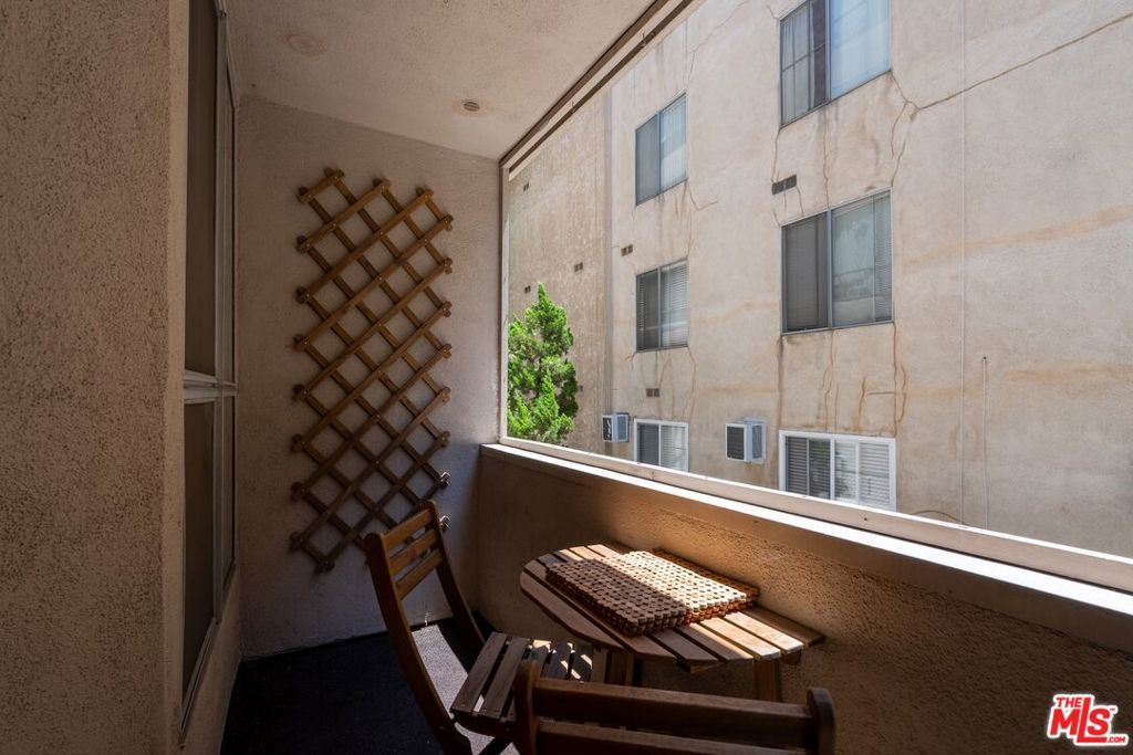 Photo of 1745 Camino Palmero Street #106, Los Angeles, CA 90046 (MLS # 25562141)