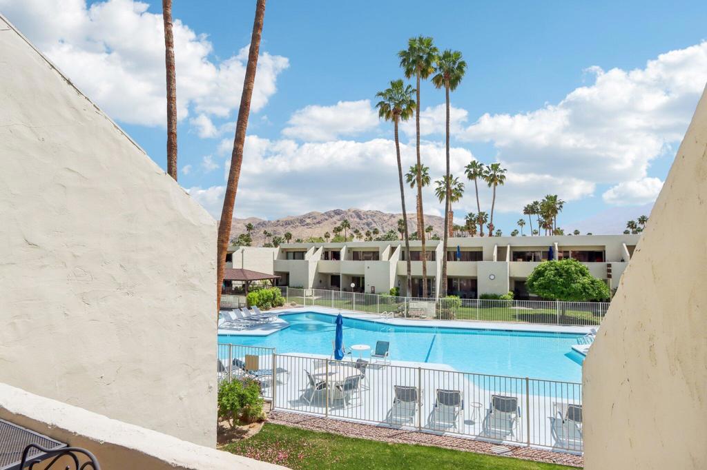 TENNIS or PICKLEBALL ANYONE? You've come to the right place! Welcome to Smoke Tree Racquet Club, where resort-style living meets the active Palm Springs lifestyle. Nestled at the gateway to the highly sought-after Indian Canyons neighborhood in South Palm Springs, this vibrant community offers everything you need--and more. Enjoy one of the largest pools in Palm Springs, a maxi-size spa, and lighted tennis & pickleball courts that are perfect for day or evening play. The adjacent dog park is a ''paw-some'' bonus your pets will love--ARF! This spacious 1-bedroom, 1-bath upper-floor condominium features a private balcony with breathtaking views of the pool and surrounding mountains. Plus, enjoy direct access to the resort amenities via a convenient semi-private rear stairway. LOCATION, LOCATION, LOCATION! Just across Sunrise Way is the rustic Smoke Tree Village, home to Ralph's Fresh Fare with Starbucks, Giuseppe's Italian, Smokin' Burgers, and more. Less than a mile away, you will find Smoke Tree Commons, offering Jensen's Fine Foods, TJ Maxx, World Market, Petco, and more shopping and dining options. Looking for a night out? The pizzazz of downtown Palm Springs is only 2.5 miles away, brimming with restaurants, shops, entertainment, and that unforgettable desert vibe.
