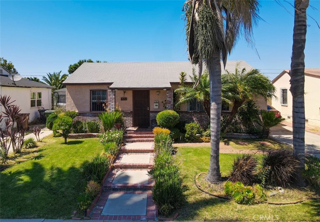 Welcome to 2225 W 153rd Street, this charming 3-bedroom, 1.5 bathroom home is tucked away on a quiet street in a vibrant Compton neighborhood. With a freshly painted interior and a beautifully renovated full bathroom, this move-in-ready property is perfect for first-time buyers, growing households, or investors. Step into a bright and airy living and dining area filled with natural light. The updated kitchen features quartz countertops, stainless steel appliances, and plenty of cabinet space—ideal for both everyday living and entertaining. The remodeled bathroom includes a new vanity and stylish tile finishes, while a convenient half-bath adds extra comfort for guests. Enjoy brand-new laminate flooring throughout the living spaces and bedrooms, all of which offer generous closet space. Additional features include laundry hookups, a spacious deck perfect for outdoor dining or gatherings. Outside, a long driveway offers ample parking for multiple vehicles, RVs, or recreational toys, leading to a detached two-car garage in the backyard—perfect for storage, a workshop, or potential ADU. The spacious lot provides room to garden, play, or expand. Conveniently located near the 91, 405, 710, and 110 freeways, this commuter-friendly home is also close to schools, parks, and shopping. Don’t miss this opportunity—schedule your private tour for your new home today!