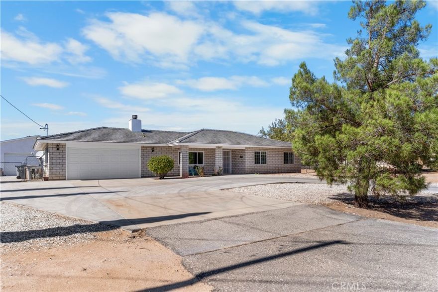 Welcome to 8926 Avocado Avenue — where space, style, and opportunity meet! This freshly painted 3-bedroom, 2-bath home sits on nearly half an acre and offers plenty of room to live, work, and play. Step inside to discover a bright and inviting floor plan with an open living area that flows seamlessly into the kitchen and dining space — perfect for gatherings and everyday comfort. The living room also boasts a cozy fireplace, creating the perfect spot to unwind on cool desert evenings.

The kitchen offers plenty of cabinet space, a breakfast bar for casual dining, and a clear view of the spacious backyard — ideal for entertaining or keeping an eye on the fun outside. The primary suite features ample closet space and a private bath, while the secondary bedrooms provide flexibility for family, guests, or a home office. Off the laundry room, you’ll find a bonus room — perfect for crafting, a small gym, playroom, or quiet workspace.

Step outside and let your imagination run wild! A massive 900 sq. ft. workshop with its own bathroom, 70-amp panel, and multiple 50-amp 220 plugs makes this property a true standout. Whether you’re a car enthusiast, hobbyist, or entrepreneur, this space is a dream come true. The private yard area behind the shop even allows for ADU potential, perfect for extended family, rental income, or a creative studio.

Located in a quiet, well-established Hesperia neighborhood, this home delivers both comfort and convenience — close to schools, shopping, and the 15 Freeway for easy commuting. With room to expand, entertain, or simply relax, this home has everything you’ve been looking for. Bring your vision and make 8926 Avocado Avenue your next move — where opportunity and lifestyle come together!

The home has new paint and floorin throughout.