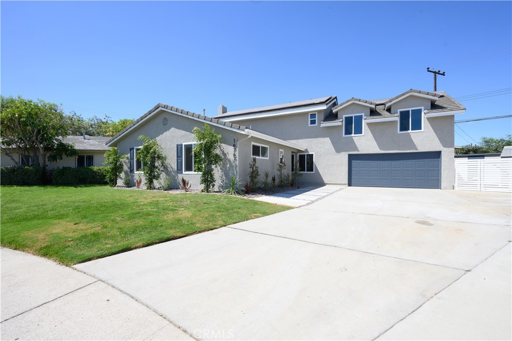 AMAZING MULTI-GENERATIONAL living or investment potential on this beautifully UPDATED 5 bedroom, 4 bathroom pool home. Downstairs you will find 3 bedrooms, 2 bathrooms, a living room with decorative fireplace, kitchen and large laundry room. Upstairs you will find 2 bedrooms, 2 bathrooms, another kitchen and a spacious living room. Both kitchens have been updated with new cabinets, sleek counter tops, tile backsplash, fixtures and stainless-steel appliances. All the bathrooms have new vanities, stylish new fixtures and custom tile work. The two Master Bedrooms, one upstairs and one downstairs, have attached ensuite bathrooms. Other features include freshly painted interior and exterior, new flooring throughout, energy efficient vinyl windows, new plumbing and light fixtures, HVAC, and indoor laundry. This home is great for outdoor fun and entertainment. There is a large, covered patio area off the downstairs living area and an enclosed backyard with an inground sparking pool and yard. Upstairs there is a large deck great for relaxing and outdoor enjoyment. This home has an attached two-car garage, RV parking, and additional off-street driveway parking. The backyard has two storage sheds perfect for toys, tools or other storage needs. Tax rolls show different bedroom count.