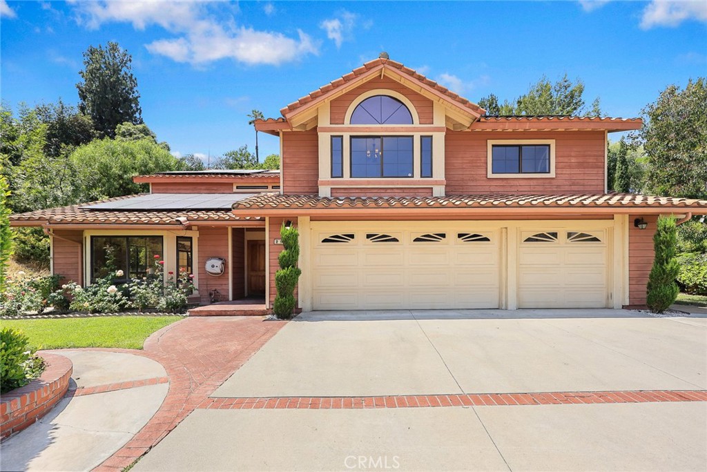 Nestled in West Covina's prestigious South Hills neighborhood, this magnificent 3,632 sq ft home on a sprawling 20,000+ sq ft lot offers luxurious living with an entertainer’s paradise backyard. Step into a bright, airy sanctuary featuring soaring ceilings, expansive French windows, and strategically placed skylights that flood the interior with warm, natural light, creating an exceptionally open and inviting atmosphere. A ground-floor suite with its own bathroom provides a versatile layout, perfect for multi-generational living. On the left side of the entry is the spacious, high-ceiling living room flows into the formal dining area. The kitchen features a walk-in pantry and a breakfast area. Adjacent is the family room with an elegant fireplace and beautiful backyard views. Upstairs, discover a vast entertainment lounge perfect for gatherings. The luxurious master suite is a true retreat, complete with a versatile private study/nook, a cozy fireplace, a private balcony, and a spa-like oversized bathroom bathed in light. Two additional guest bedrooms share the bathroom, which is conveniently located in the hallway. Benefit from cost-effective, leased solar panels and energy-efficient LED lighting throughout. A laundry room and an attached three-car garage complete the interior. The expansive backyard is a private oasis with a sparkling pool and a mature fruit orchard boasting pomegranate, lemon, orange, plum, apricot, apple, and mandarin trees. Living in South Hills means enjoying a premier, tranquil environment within easy reach of award-winning schools, upscale shopping, diverse dining, and major freeways. Walking distance to South Hills Golf Course/ Country Club, perfectly balances serene living with exceptional accessibility. Don't miss the opportunity to own this home in the sought-after South Hills community of West Covina!!
Property Video ==> https://player.vimeo.com/video/1103381963