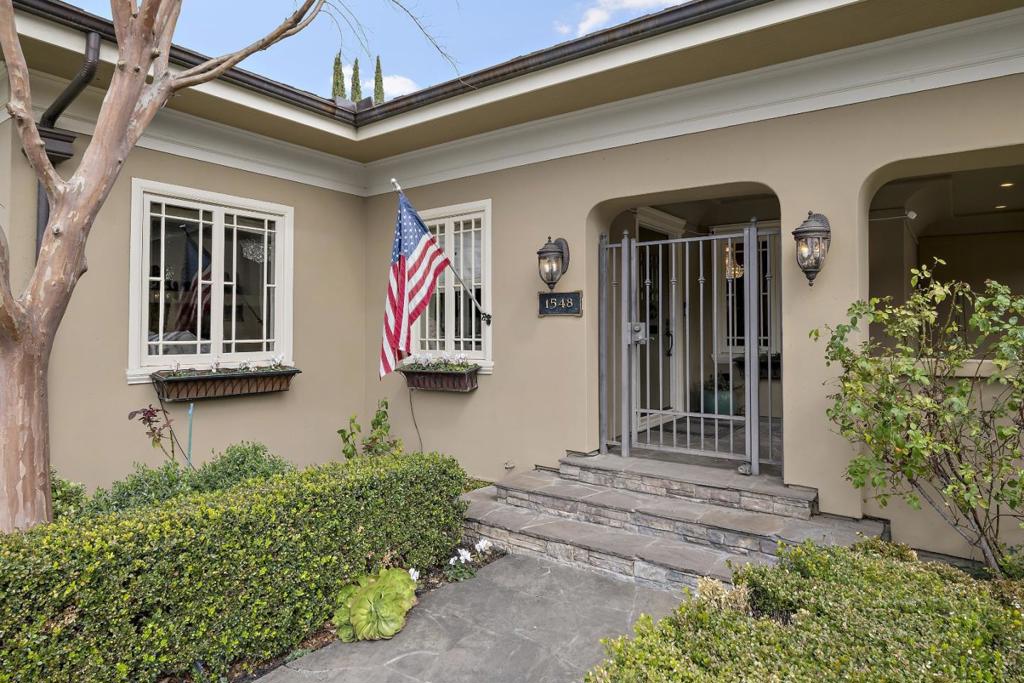 Downtown Willow Glen / One of a kind Mediterranean Estate features 3169 square foot home with ensuite on main level / Additional studio apartment with private entrance adds an additional 519 square feet / Top end finishes throughout / Separate formal dining room with french doors and wainscoting with encased mirrors / Coved ceilings frame custom chandeliers / Gourmet kitchen with Viking appliances surrounded by designer cabinets under granite counters / Primary suite is over 1000 square feet of slate and marble flooring / Private office and gas fireplace makes the upper level a supreme retreat / Exquisite finishes include engineered hardwood floors and crown moldings / Finished 1216 square foot basement has the perfect space for your custom wine cellar or humidor / Complete privacy behind custom walls with ornamental iron gates / Aviary for song birds or spoil your chickens in their custom coop / Manicured landscape of ivy and mature trees bordered by travertine and limestone hardscape / Portico extends living areas to the outdoors / Entertainers dream with gas fireplace and outdoor heaters / Built in stainless appliances include Lynx BBQ with marble island / Surround sound and bullfrog spa / Oversized two car garage with high ceilings and custom storage cabinets / Welcome Home!