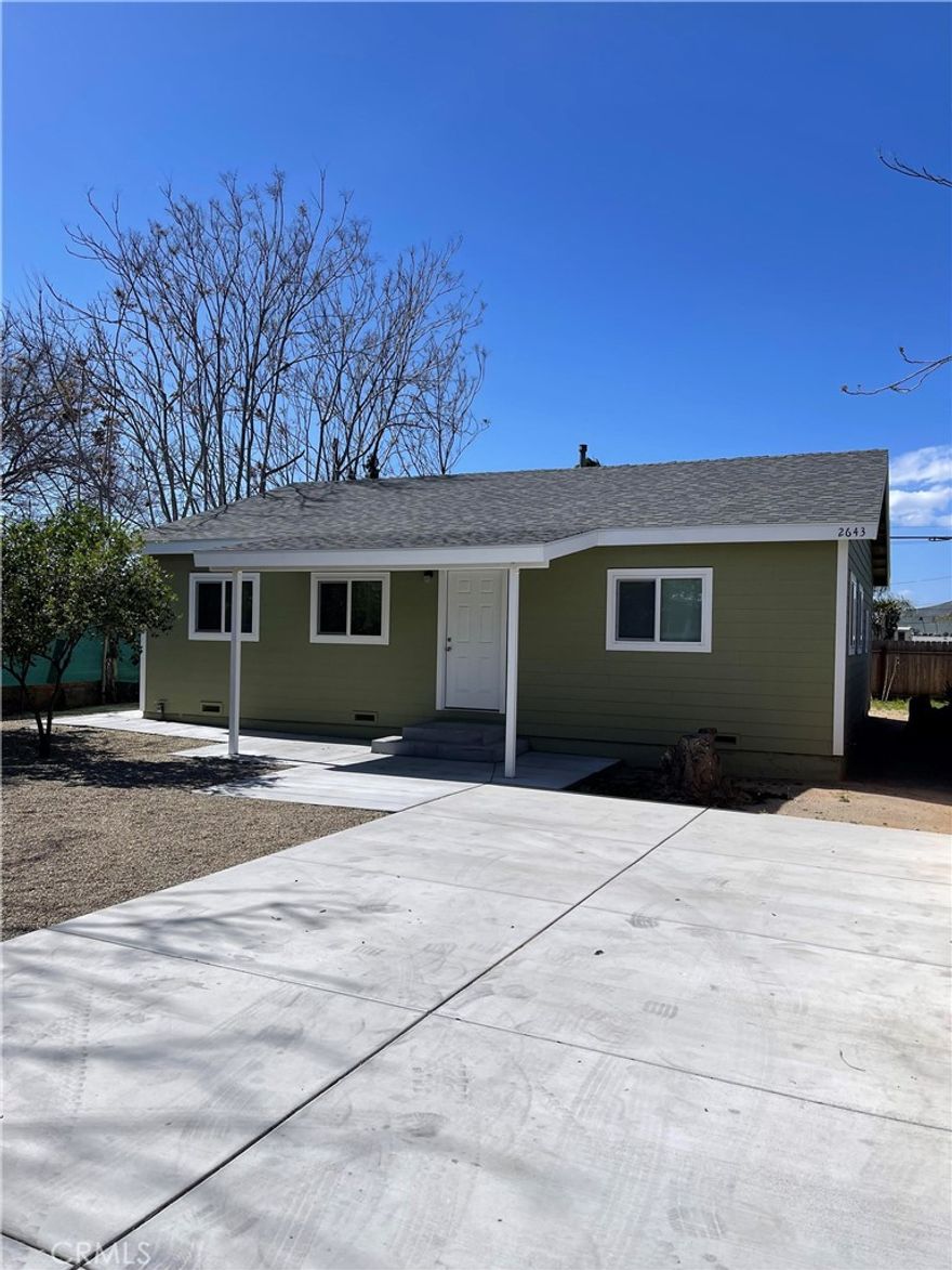 Detached single family residence on a large lot. The home is spacious with recessed lighting and vinyl plank floors. It has everything you need to make it yours. There is a large backyard. It features 3 bedrooms, 2 bathrooms, storage space in the hallway and a separate laundry room with washer & dryer hook ups inside the house. Additional features include large closets, an eating area in kitchen and a lime tree in the front yard. The home has a shared driveway with the house in front. The driveway is long and provides access to both houses. There are two designated parking spaces on the driveway in front of the house. This home does not have a garage. However, it does have a large storage shed.