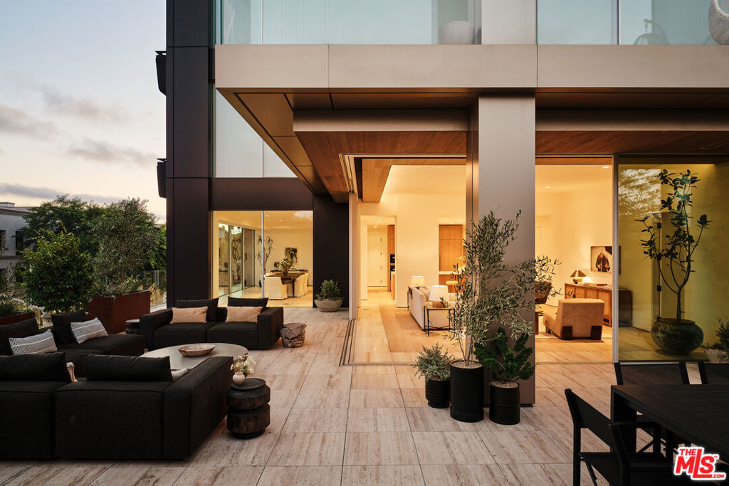Residence 4D | The ultimate emblem of California-style indoor/outdoor living, this southeast-corner home at 8899 Beverly opens to a breathtaking 1,500 SF landscaped terrace. Designed by award winning architect Olson Kundig and spanning 2,463 interior SF, Residence 4D offers two expansive entertaining areas and dual primary suites. Floor-to-ceiling operable window walls by Vitrocsa connect the entertaining spaces directly to the oversized garden terrace. The custom chef's kitchen features white oak cabinetry, Italian Calacatta gold marble, and appliances by Gaggenau, Miele, and Sub-Zero. The two bedroom suites sit at opposite ends of the home for privacy and balance. Each includes a walk-in closet and spa-inspired bath clad in Italian travertine with dual vanities. 8899 Beverly provides full-service living with 24-hr concierge and valet, state-of-the-art fitness center, and a quarter-acre retreat with resort-style pool, spa, fireplaces, and open-air kitchen steps from West Hollywood's finest dining, shopping, and entertainment. Residence 4D is the last of the coveted garden-terrace residences at 8899, offered new from the developer.