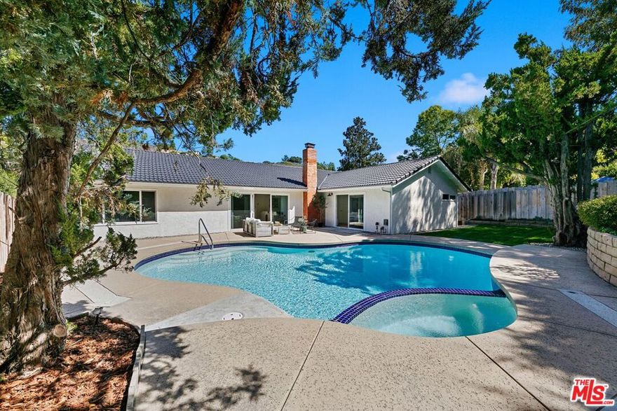 Stunning single story four bedroom pool home with some of the finest finishes in Mulwood.  Come feel the difference quality makes on these 10 inch french oak floors and relax by the beautifully finished Venetian plastered fireplace in this inviting home. Entertain guests by cooking them a meal in this well appointed kitchen featuring high end appliances and beautifully crafted Calacatta countertops. Great flowing floor plan with the family, living and dining areas, and large primary bedroom all looking out over a gorgeous pool.  The primary bedroom offers ample space and features an elegant walk-in closet with cedar lined cabinetry. All three bathroom vanities and the laundry feature the same beautiful stone seen in the kitchen. Be the first to enjoy this turn key home.  It is a must see!