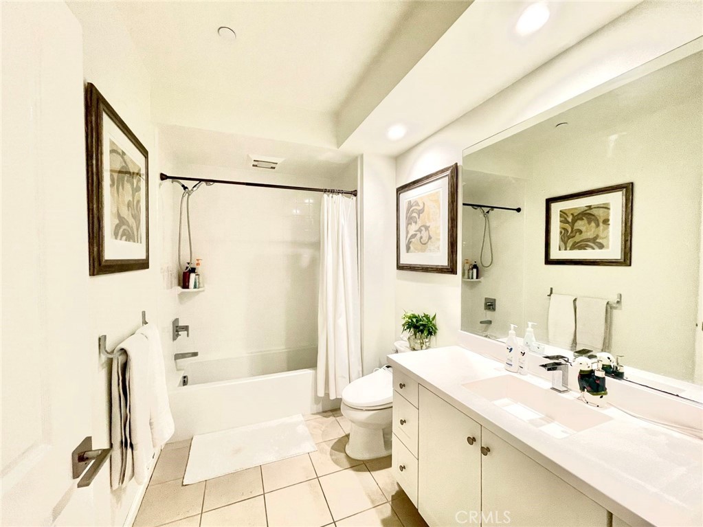 Charming single-level home in Eastwood Village with 2 bedrooms and 2 baths. Features a welcoming front porch, open-concept layout, and no carpet—upgraded tile and hardwood flooring throughout. Includes an attached tandem 2-car garage, private patio, and comes fully furnished, move-in ready. Just walking distance to Eastwood Elementary School, with resort-style community pools, parks, playgrounds, and award-winning Irvine schools.