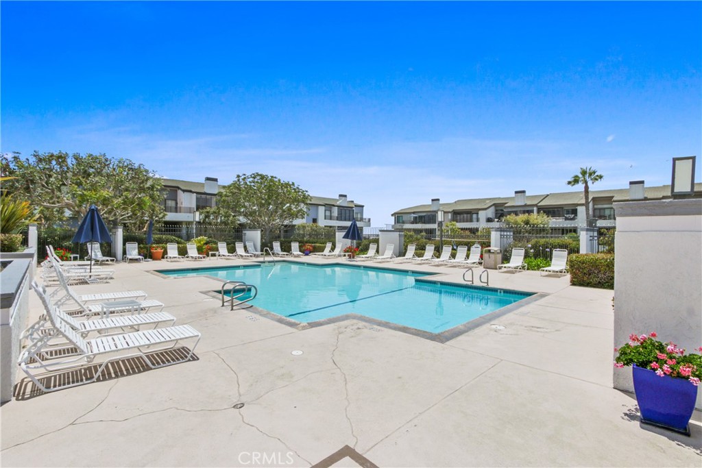 Want to experience Resort style living in gated Villa Balboa community, minutes from the beach? This gorgeous remodeled first floor, corner, 2 bedroom/1.25 bath condo offers an oversized primary bedroom, guest bedroom, with a double vanity on each side of the bathroom. The condo has accented tile, recessed lighting, and LVP flooring throughout. The kitchen has been remodeled with quartz counter tops, top of the line stainless-steel appliances and has a breakfast bar with bar stools. Take in the ocean breeze in the oversized patio. The unit comes with 2 parking spaces; one assigned secured underground space with a storage cabinet and one open parking space. Have fun and enjoy the spacious clubhouse, two pools and spas, tennis/pickleball courts, and community fitness center. Sunset Ridge Park is within walking distance and the beach is just a few steps away. Ideal for sunrise and sunset walks. Unit comes partially furnished for $4,495 (2 beds, 2 stools, 1 dining table w/chairs) with the option of taking it unfurnished for $3,995 per month.