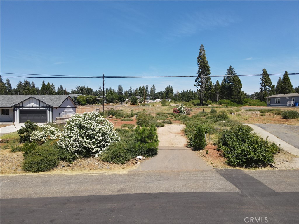 Nestled above the street overlooking the surrounding neighborhood sits .23 acres of opportunity. Prior to the campfire the property was home to 3 bedroom 2 bath house, with 1,468 square feet of living space. The existing leach field has less than a year of use, as it was replaced just before the home was lost. Part of the PPOA home owners association the new owners can take advantage of amenities including the club house, pool, tennis courts, play ground and walking trails!
