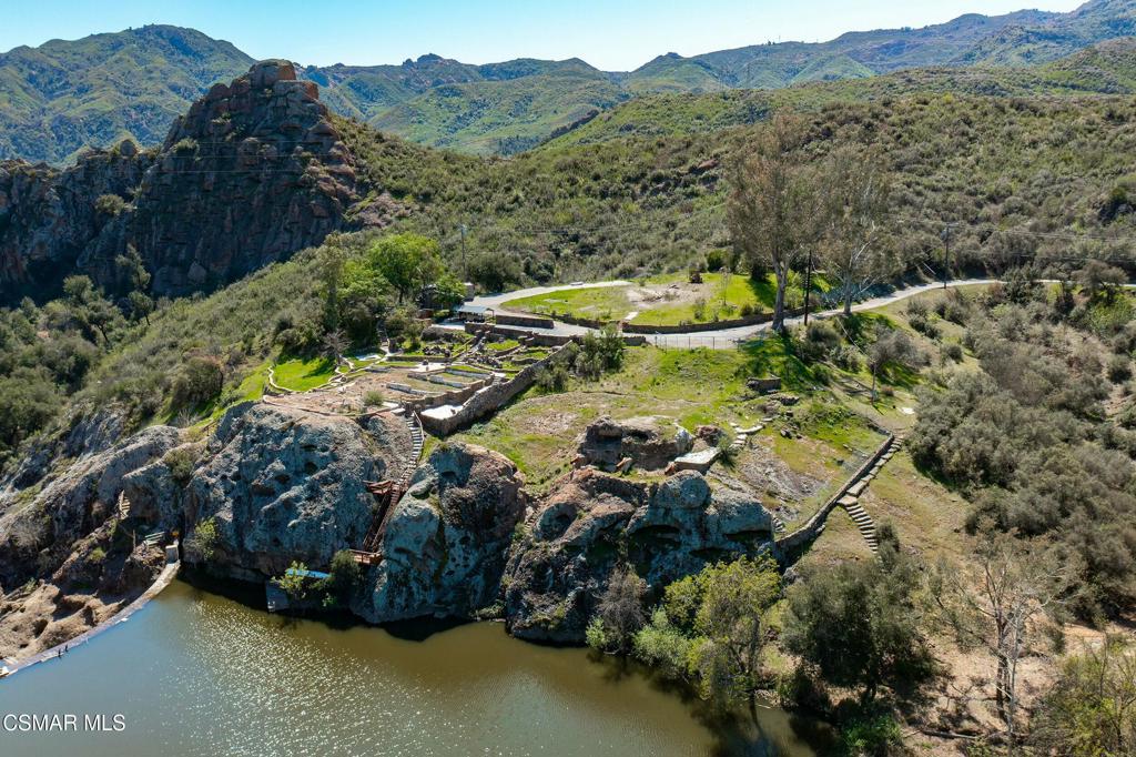 Majestic Views & Serenity. Welcome to the most scenic lot on Malibou Lake. Unobstructed panoramic views of lake, dam, and Malibu Creek State Park. Private and secure gated community--And your own personal boat dock. Minutes away from Malibu and PCH beaches. Quick few miles to restaurants, amenities, and freeway access. Malibou Lake Mountain Club membership includes boating, tennis, swimming pool, and community events. Option to purchase adjacent lot together at 28801 S Lakeshore.