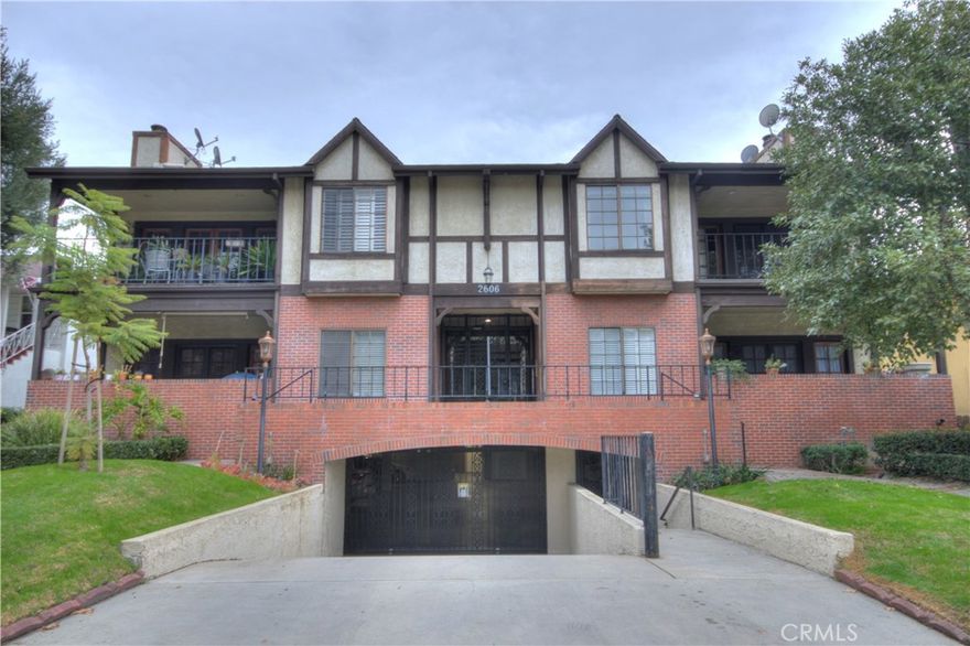 Beautiful SPACIOUS, top floor, single-level unit in gated complex of only 7 units! You will fall in love with street facing, one common wall unit in sought after Verdugo Woodlands. Wood floored large living room features vaulted ceilings with a fireplace opens to the private deck/patio and to the formal dining room. Bright kitchen with in-cabinet custom features and a breakfast area and comes with a fridge. Primary bedroom features a huge walk-in closet, vaulted ceilings and plantation shutters. En-suite bathroom has double sinks, a tub and a separate shower. One of the two secondary bedrooms is currently being utilized as a den with a  bathroom nestled in between them. In the hallway you will find a washer/dryer and ample closet space. Unit features central air and heat, a water softening system, 2 parking spaces, private storage space. The complex offers a tranquil courtyard with hanging planter baskets and flowers abound. Some of the pictures have been virtually staged.