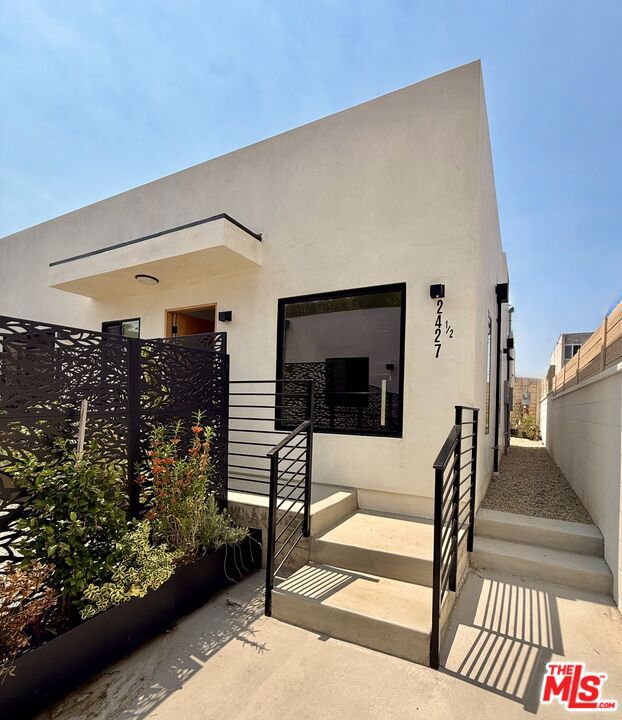Modern 3BD/2BA Gated Back House w/Private Yard, Rooftop Terrace, Driveway Parking & In-Unit Laundry! Discover 2427 1/2 Shoredale Ave, a beautifully crafted new-construction 3-bedroom, 2-bath back house offering a perfect blend of luxury, privacy, and indoor-outdoor living. Step into a bright, sun-filled living room with wide-plank hardwood floors that flow into a sleek designer kitchen, complete with new stainless steel appliancesincluding a dishwasher, stove, refrigeratorand central AC/heat. Spa-inspired bathrooms feature elegant, modern finishes, bringing a touch of luxury to your daily routine. Enjoy the open-concept layout with ample closet space, a kitchen pantry, and in-unit laundry for maximum convenience. Outside, you'll find a private backyard, two dedicated driveway parking spots with a EV Charger, and a rooftop terrace ideal for entertaining or unwinding under the stars.Located on a quiet street in the trendy neighborhood of Frogtown. Just steps from the LA River bike path and all the local favorites like Salazar, Loreto, Wax Paper, Frogtown Brewery, and only minutes from Echo Park, Silver Lake, and Atwater Village.