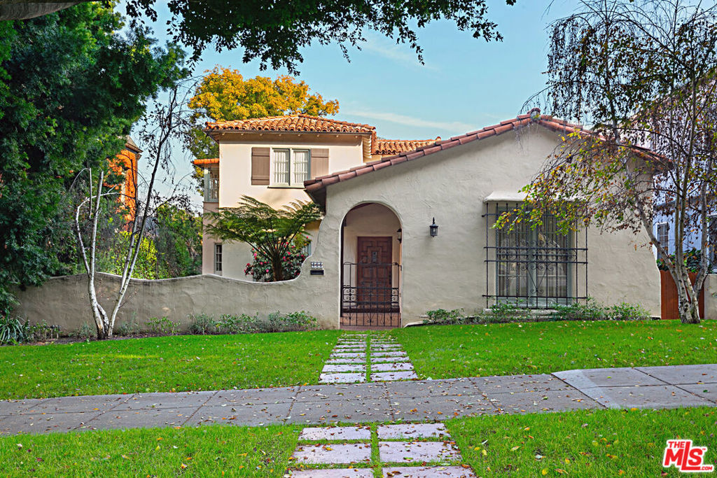 This Spanish-style residence blends timeless character with modern updates in coveted City of Beverly Hills location. Short walk to dining, shopping on Beverly Drive and houses of worship. Close to Roxbury Park & Beverly Hills High School. From the moment you enter, you're greeted by rich wood floors, decorative moldings, & beautiful tile work. Features 4 bedrooms (or 3 bedrooms plus convertible den). Expansive living room, with large picture windows and inviting fireplace, perfect for relaxing & entertaining. Thoughtfully renovated kitchen features granite countertops, stainless steel appliances, and flows into formal dining room. First floor also features large bedroom with en-suite bathroom, convertible den and breakfast room. Second floor features primary suite with walk-in closet, an adjoining sunroom & guest bedroom. Private, grassy backyard. Select property photos virtually staged for marketing purposes. Tenant will be required to have Renters Insurance Policy with liability coverage (and additional coverage for pet -if applicable).