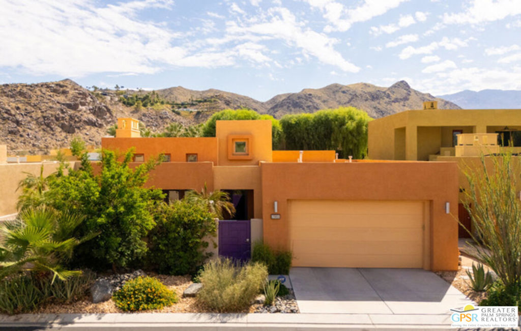 SOPHISTICATED DESERT LIVING IN LUMINAIRE PRICED TO SELL - Welcome to Luminaire, a sought-after enclave in South Palm Springs' Araby/Smoketree neighborhood where community and privacy blend seamlessly. Offered at an exceptional value, this 2-bedroom, 2-bath residence is your gateway to the refined desert lifestyle you've been seeking. From the moment you arrive, the home's thoughtful design stands out. Floor-to-ceiling windows frame garden vistas from nearly every room, flooding the interior with natural light and creating a seamless connection with the outdoors. High ceilings, decorator niches and an airy open-concept living space add architectural drama, while cozy window seats and a gas fireplace bring warmth and intimacy. The remodeled kitchen is a true showpiece, featuring custom cabinetry, molding detail, a tile backsplash, pull-out pantry drawers, Bosch stainless refrigerator, Fisher & Paykel double drawer dishwasher, GE Profile oven, microwave and gas cooktop. The spacious dining room opens to a tranquil fountain courtyard, filling the space with soothing sound - ideal for dinner parties. Many neighbors have converted this room into a third bedroom or office, offering flexibility for your lifestyle. Both bedrooms are generously scaled retreats. The primary suite features oversized sliders leading to the covered patio, stationary clerestory windows, a spa-like bath with dual vanities, sunken tub, shower and a walk-in closet with abundant storage. The secondary ensuite bedroom, with its cozy alcove, functions beautifully as a second primary suite. A bright powder room, large laundry room with cabinets and utility sink, and oversized two-car garage round out the thoughtful floor plan. Outdoors, a PebbleTec pool and spa provide the perfect spot to enjoy dramatic mountain views. Mature Meyer lemon and tangelo trees frame the backyard, while covered patios and shaded dining areas invite year-round entertaining. On fee land - you own it! - with low HOA dues, Luminaire offers a unique lifestyle: a welcoming sense of community with monthly neighborhood gatherings, while still maintaining privacy and tranquility. Whether you're seeking a full-time residence or a desert retreat, this property combines elegance, comfort, and value. This is more than a home - it's an invitation to experience the best of Palm Springs living.