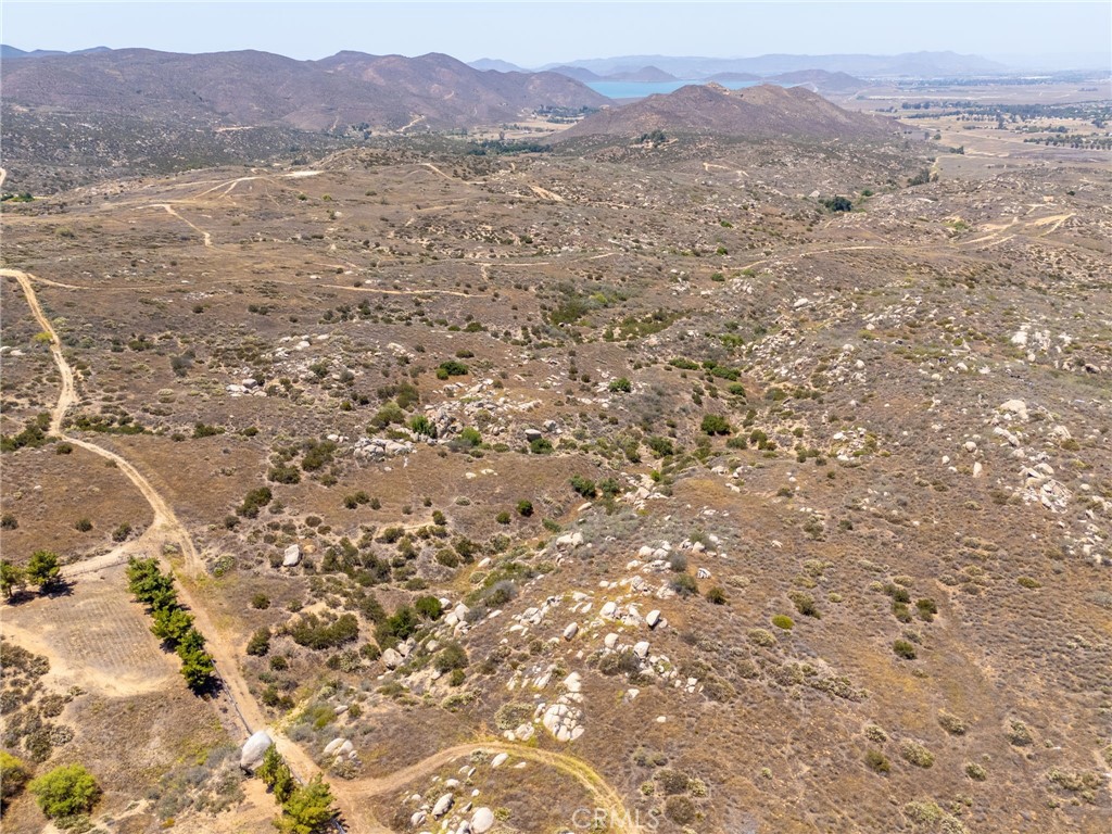 Discover the potential of 0 Benji Lane in Hemet, over 20 acres of serene, rural land surrounded by picturesque ranch style homes and natural beauty. This expansive parcel offers endless possibilities to build your dream estate, equestrian retreat, or private getaway. Nestled in a peaceful setting with wide open skies and panoramic views, the property is ideally located near Southern California’s scenic Wine Country, including Temecula, and just a short derive to Hemet Lake, Winchester, Menifee, and other growing communities. Enjoy tranquility of country living while still being close to modern conveniences. Whether you’re seeking space, privacy, or inspiration from nature, this land delivers the perfect backdrop for your vision.