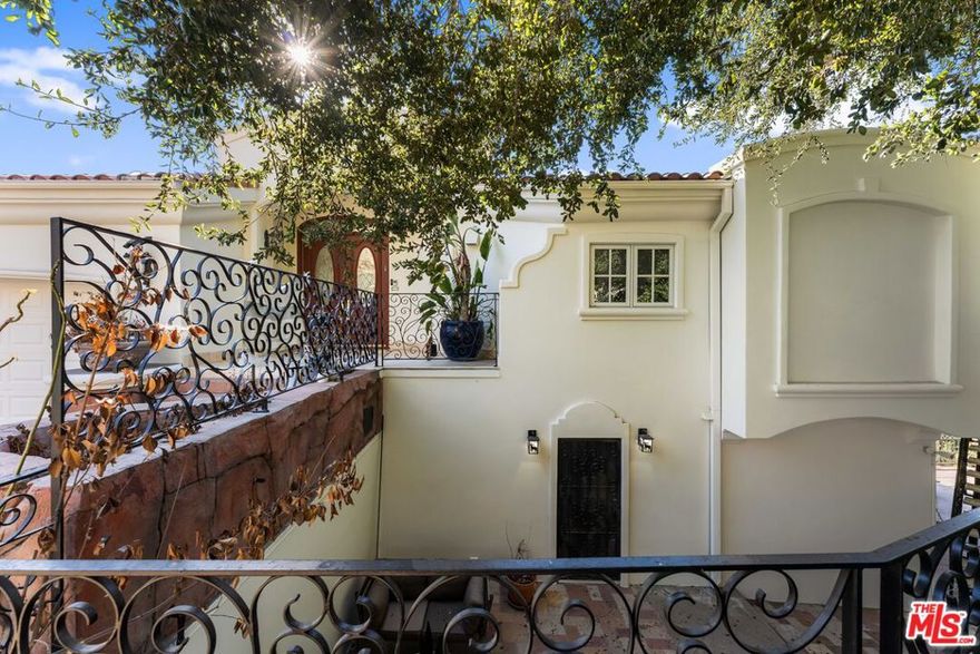 Welcome to this stunning one-of-a-kind home perched in the hills of Studio City with breathtaking panoramic views! The open main level offers a bright living room with fireplace and a modern kitchen with stainless steel appliances, Caesar-stone countertops, island seating, and dining area. Fold-away glass doors open to a deck with fire-pit and incredible Valley and mountain views. The luxurious primary suite includes a fireplace, balcony, spa-like bath, walk-in closet, BBQ patio, and a second deck with a swim spa hot tub. The lower level features a family room with balcony, gym, steam shower, and bonus room. Designer upgrades include LED lighting, surround sound, security system, whole-house water filtration system. The terraced yard is landscaped with beautiful greens. A must-see gem offering unmatched views and modern luxury! Available long or short term.