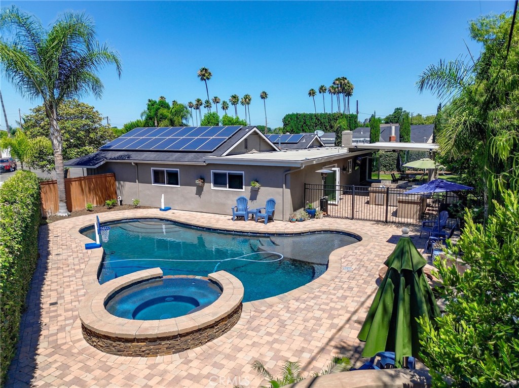Stylish Single-Story Ranch with Indoor-Outdoor Living, Pool & Spa!
Welcome to this beautifully updated single-story ranch home featuring 4 spacious bedrooms, 2 bathrooms, and an ideal layout for modern living and entertaining. Step into a light-filled open floor plan with wood-look tile flooring and recessed lighting throughout, seamlessly connecting the expansive living area to a bright, updated kitchen designed for gathering. Dual pane windows enhance energy efficiency while inviting in natural light.
Enjoy true indoor-outdoor living with a stunning nano-style sliding wall that opens to a fully covered patio—perfect for entertaining—with a built-in BBQ and generous lounge space. The large backyard is your private oasis, featuring a sparkling pool, relaxing spa, and ample room to host or unwind. The floorplan is thoughtfully designed to embrace Southern California’s lifestyle, blending indoor comfort with outdoor enjoyment.
The bedroom wing offers four well-proportioned rooms, perfect for families or flexible use as a home office or guest space. To top it off, this home includes a 20 year pre-paid solar lease, delivering energy savings and peace of mind. This turnkey retreat blends comfort, style, and smart upgrades in one of the area's most desirable settings. Don’t miss your chance to own it!