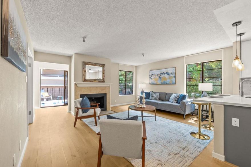 Lowest priced 2 bedroom condo in Burlingame located in close proximity to Burlingame Avenue and downtown! Spanning 993 square feet, this tastefully renovated condo boasts new wood floors throughout, new appliances, kitchen cabinets and counter tops, light fixtures and much more. This first floor corner unit is located at the rear of the building allowing abundant natural light into almost every corner of the home.Enjoy the comforts of a spacious living room leading to a light-filled sun room with access to a concrete patio overlooking the common pool area. The open kitchen comes fully equipped with all new modern appliances including a refrigerator, and dishwasher making meal preparation a breeze. Adjacent dining area and counter top bar eases the service and consumption of meals. The flooring throughout the home ensures a clean and attractive look suitable for various interior design choices. The secluded bedroom leads into the updated bathroom with double sinks and shower over tub. Convenience is key with an in-unit washer and dryer ensuring laundry tasks are handled with ease. This home is located within the Burlingame School District. An assigned single-car parking space inside the gated common garage is included.