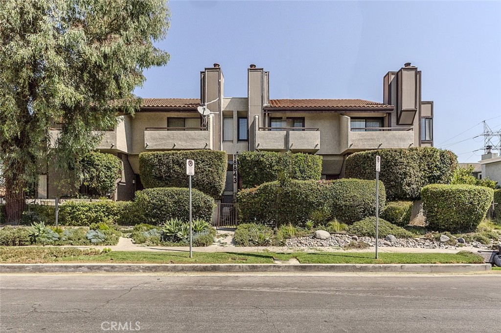 Welcome to this beautifully updated 2 bedroom, 2.5 bathroom townhome in a quiet gated community in Tarzana. The open layout, warm wood flooring, and large windows create a bright and inviting space. The living room includes a fireplace and sliding doors that lead to a private patio, ideal for relaxing or hosting guests. The kitchen features granite countertops, stainless steel appliances, and ample cabinet space. It opens to the dining area for easy entertaining. Upstairs, both bedrooms include en suite bathrooms, vaulted ceilings, and large closets. The primary suite offers a walk in closet and a private balcony. Additional features include in unit laundry, direct access to a 2 car garage, and access to the community pool and spa. Pet friendly with low HOA dues. Located just minutes from Ventura Blvd, this home places you near top rated restaurants, cafes, markets, fitness studios, and boutiques. Enjoy easy access to major freeways, nearby parks, and great local schools. This central location combines suburban comfort with urban convenience.
