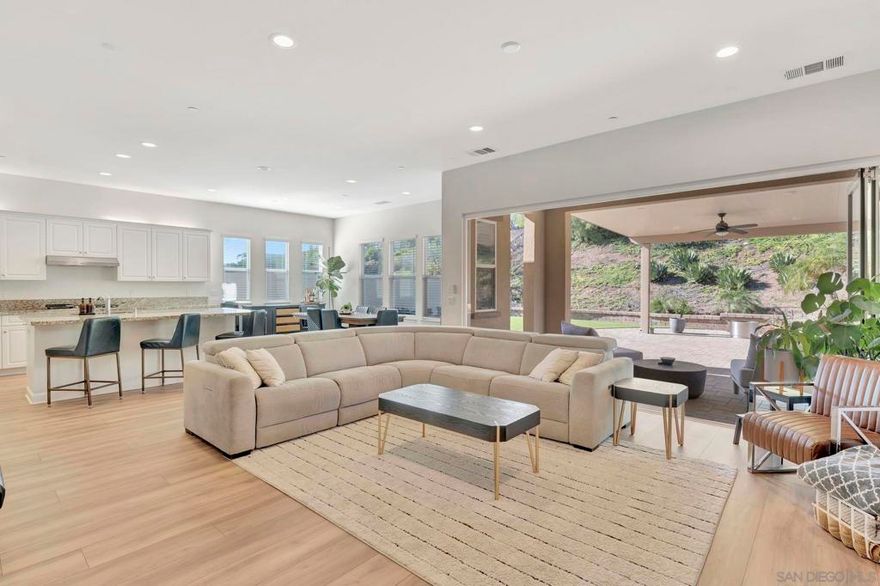 Experience elevated living in one of Escondido’s most desirable communities, Canyon Grove. This beautifully upgraded single-story home is privately positioned at the end of a quiet cul-de-sac on an expansive lot with a long driveway that offers a true sense of space and privacy. Inside, the open and functional floor plan is filled with natural light. Three generously sized bedrooms and an office, thoughtfully designed living spaces create both comfort and flexibility. Premium upgrades include paid solar panels, an advanced electronic air cleaner, and two EV chargers, including one for Tesla, delivering efficiency and modern convenience. The backyard is designed for easy entertaining and everyday enjoyment, featuring a custom putting green and mature landscaping that enhances the private setting. With low HOA fees and no Mello-Roos, this property represents incredible value in a prime location close to shopping, dining, parks, and top amenities. A rare opportunity to own a home that combines privacy, function, and style in one of the area’s most sought-after neighborhoods.