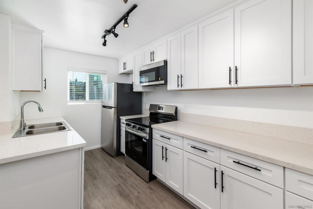 Fully remodeled Turnkey Condo. Everything is brand new! Located in the Desirable College Area! Beautifully updated corner unit on the second floor with no one above you. This light-filled home features brand new stainless steel appliances, quartz countertops in the kitchen and bath, dual-pane windows throughout, new lighting, wall A/C and heat, and luxury vinyl plank flooring. Enjoy the convenient location directly across from the Joan Kroc Center — open to the public with pool, gym, ice skating, pickleball, and basketball courts available by day pass. Walk to shopping, dining, and public transportation. Just 3 miles to SDSU!