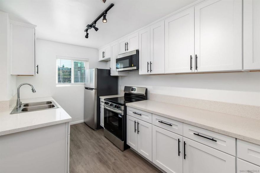 Fully remodeled Turnkey Condo. Everything is brand new! Located in the Desirable College Area! Beautifully updated corner unit on the second floor with no one above you. This light-filled home features brand new stainless steel appliances, quartz countertops in the kitchen and bath, dual-pane windows throughout, new lighting, wall A/C and heat, and luxury vinyl plank flooring. Enjoy the convenient location directly across from the Joan Kroc Center — open to the public with pool, gym, ice skating, pickleball, and basketball courts available by day pass. Walk to shopping, dining, and public transportation. Just 3 miles to SDSU!