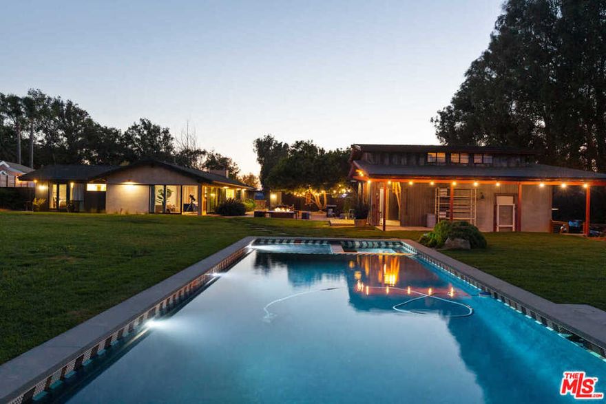 Private and gated Point Dume compound on over one flat acre with deeded beach rights. The main house designed by legendary architect Cliff May, with reclaimed, rustic wood accents, hardwood floors and high ceilings, offers a large great room with fireplace, dining area and skylight, granite island kitchen. Sun-filled sitting/reading room; and warm and inviting owners suite that opens to the exterior. Guest home with sleeping areas and laundry. Barn/ garage with a loft space. The spacious landscaped grounds offer the ultimate in outdoor entertaining & living, with salt water pool +spa, teepee, multiple sitting & dining areas, outdoor shower, fire pit and ample guest parking. Private deeded beach key access to Riviera II, Little Dume. In addition, there are permits far along in process for future expansion with the city. This ultra cool Point Dume mid-century is not to be missed.